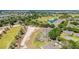 A view from above of the neighborhood with the golf course and ponds at 9591 Sw 70Th Loop, Ocala, FL 34481