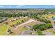 Wide aerial view of home and surrounding golf course and community at 9591 Sw 70Th Loop, Ocala, FL 34481