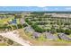 Beautiful aerial view of the community featuring meticulously maintained landscaping, a golf course and mature trees at 9591 Sw 70Th Loop, Ocala, FL 34481
