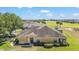 An aerial view of the home, showcasing its well-maintained lawn and landscaping at 9591 Sw 70Th Loop, Ocala, FL 34481
