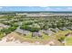 Stunning aerial view of a well-maintained community, manicured landscaping, and perfectly lined trees at 9591 Sw 70Th Loop, Ocala, FL 34481