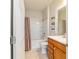 Bathroom with neutral-colored walls, a single sink vanity and a shower-tub combo with curtain at 9591 Sw 70Th Loop, Ocala, FL 34481