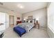 Comfortable bedroom with carpet flooring, queen bed and nice lamps at 9591 Sw 70Th Loop, Ocala, FL 34481
