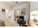 The room features a desk area, shelving, and a view into an adjacent bedroom at 9591 Sw 70Th Loop, Ocala, FL 34481