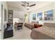Guest bedroom with two twin beds, desk, and built-in shelving for extra storage at 9591 Sw 70Th Loop, Ocala, FL 34481