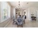 Dining room with chandelier, large window and stylish chairs at 9591 Sw 70Th Loop, Ocala, FL 34481