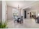Formal dining area boasts bright natural light from the window and a decorative light fixture at 9591 Sw 70Th Loop, Ocala, FL 34481