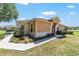 A well maintained front yard and walkway enhance this charming home's curb appeal at 9591 Sw 70Th Loop, Ocala, FL 34481
