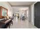 Elegant entry with a chandelier-lit dining area that seamlessly blends with the living spaces at 9591 Sw 70Th Loop, Ocala, FL 34481