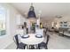 Open floor plan with kitchen views, island seating, and natural light, complemented by modern appliances at 9591 Sw 70Th Loop, Ocala, FL 34481