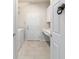 Laundry room with white cabinets, sink and newer appliances for convenience at 9591 Sw 70Th Loop, Ocala, FL 34481