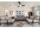 Comfortable living room with a sofa, chairs, and tasteful decor, creating a cozy and inviting atmosphere at 9591 Sw 70Th Loop, Ocala, FL 34481