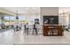View of living room leading into kitchen and dining area, boasting lots of natural light and outdoor views at 9591 Sw 70Th Loop, Ocala, FL 34481