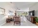 Inviting living room featuring comfortable seating, natural light, and a seamless flow to dining and kitchen areas at 9591 Sw 70Th Loop, Ocala, FL 34481