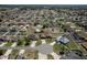 Aerial view of a residential neighborhood featuring well-maintained homes with fenced backyards and mature trees at 9721 Sw 53Rd Ct, Ocala, FL 34476