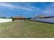 Large backyard enclosed with a white fence, providing a secure space for Gathering and pets to enjoy at 9721 Sw 53Rd Ct, Ocala, FL 34476