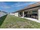 A well-maintained backyard and covered patio area with outdoor seating, perfect for relaxing and entertaining at 9721 Sw 53Rd Ct, Ocala, FL 34476