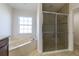 A primary bathroom features a shower, tub, vanity with double sinks, and tile floors at 9721 Sw 53Rd Ct, Ocala, FL 34476