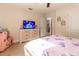 A bedroom features a TV on dresser and play kitchen at 9721 Sw 53Rd Ct, Ocala, FL 34476