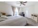 Bright bedroom with light walls, a desk near windows, and neutral carpet at 9721 Sw 53Rd Ct, Ocala, FL 34476
