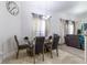 Chic dining area featuring a glass table, stylish chairs, and plenty of natural light at 9721 Sw 53Rd Ct, Ocala, FL 34476