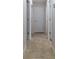 Hallway with tile flooring and white doors at 9721 Sw 53Rd Ct, Ocala, FL 34476