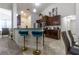 Well-equipped kitchen with breakfast bar, dark cabinetry, and stainless steel appliances at 9721 Sw 53Rd Ct, Ocala, FL 34476