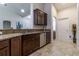 A kitchen featuring stainless steel appliances, granite countertops, and dark wood cabinets at 9721 Sw 53Rd Ct, Ocala, FL 34476