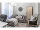 Cozy living room with soft gray furnishings, plush rug, and ample natural light at 9721 Sw 53Rd Ct, Ocala, FL 34476