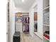 Organized walk-in closet with built-in shelving and drawers for optimal storage at 9764 Sw 81St Ln, Ocala, FL 34481