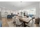 This dining room features views into the open kitchen, Gathering room, and an abundance of natural light at 9764 Sw 81St Ln, Ocala, FL 34481