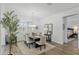 Dining room featuring natural light, seating for six, and access to the main bedroom at 9764 Sw 81St Ln, Ocala, FL 34481