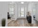 Inviting foyer with wood flooring, stylish decor, and a view into the adjacent rooms at 9764 Sw 81St Ln, Ocala, FL 34481