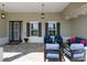 Covered front porch with comfortable seating, perfect for relaxing outdoors at 9764 Sw 81St Ln, Ocala, FL 34481