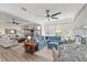 Spacious living room with hardwood floors, comfortable furniture, and views into other rooms at 9764 Sw 81St Ln, Ocala, FL 34481