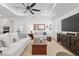 Spacious living room with modern furniture, a large television, and stylish decor at 9764 Sw 81St Ln, Ocala, FL 34481