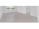 A brightly lit bedroom has large windows and neutral-colored tile flooring at 9945 Sw 83Rd Ln, Ocala, FL 34481