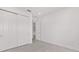 A bright bedroom with sliding door closet and neutral walls offers a versatile living space at 9945 Sw 83Rd Ln, Ocala, FL 34481