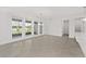 Dining area features tile flooring and natural light from large windows and backyard views at 9945 Sw 83Rd Ln, Ocala, FL 34481