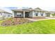 Charming single-story home features a stone accent base, well-maintained lawn, and inviting walkway at 9945 Sw 83Rd Ln, Ocala, FL 34481