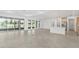 Spacious open-concept living room featuring tile floors, recessed lights, and natural light at 9945 Sw 83Rd Ln, Ocala, FL 34481