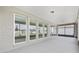 Covered and screened in patio with large windows at 9945 Sw 83Rd Ln, Ocala, FL 34481