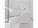 Walk-in shower features white subway tiles, a glass partition, and a built-in seat at 9945 Sw 83Rd Ln, Ocala, FL 34481