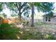 Enjoy outdoor living in this fenced backyard with mature trees that provide plenty of shade at 10 Banyan Track Way, Ocala, FL 34472