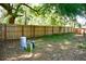 A spacious fenced-in backyard, featuring a well pump with room for various outdoor activities at 10 Banyan Track Way, Ocala, FL 34472