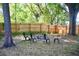 Spacious backyard features a fire pit and seating, perfect for entertaining at 10 Banyan Track Way, Ocala, FL 34472