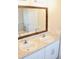 Bathroom features a double vanity with modern sinks, a large mirror, and stylish wood trim at 10 Banyan Track Way, Ocala, FL 34472