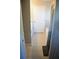 Bright bathroom featuring a walk-in shower, tiled floors, and white door at 10 Banyan Track Way, Ocala, FL 34472