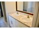 Bathroom with double sinks, granite countertops, and modern fixtures offering a spa-like experience at 10 Banyan Track Way, Ocala, FL 34472