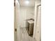 Well-organized laundry room equipped with modern washer and dryer units, plus ample storage at 10 Banyan Track Way, Ocala, FL 34472